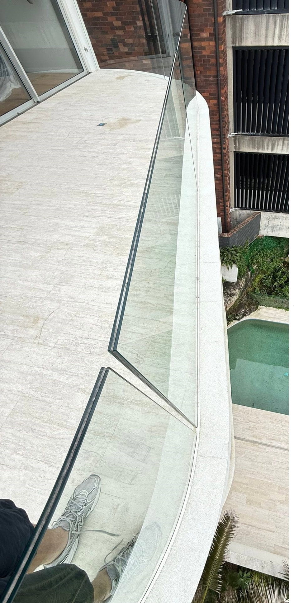 Balcony and pool surround restored after Jetmate pressure cleaning
